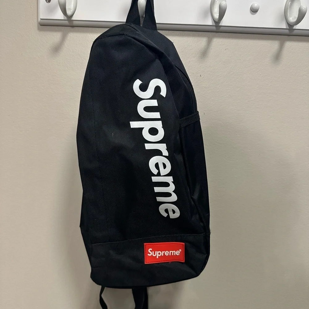 Supreme Black Backpack with White Logo and Red Patch